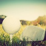 Playing golf, ball on tee and golf club. Vintage, retro style